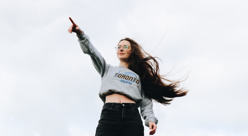 woman pointing using her right hand